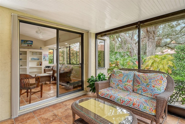 sunroom / solarium featuring vaulted ceiling and ceiling fan