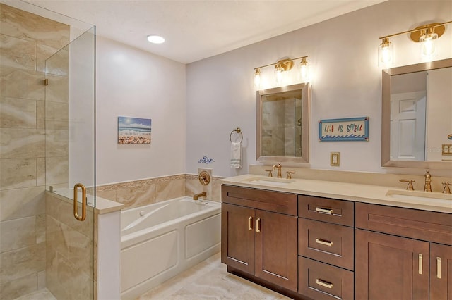 bathroom featuring vanity and shower with separate bathtub