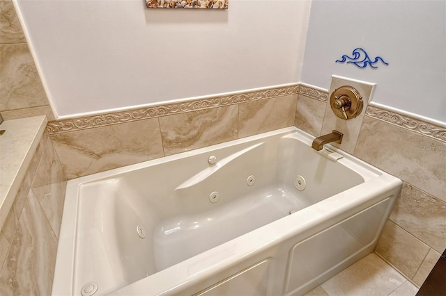 bathroom featuring a tub to relax in and tile walls