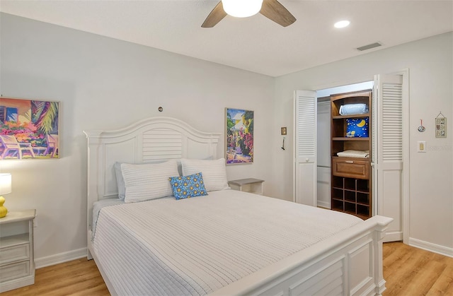 bedroom featuring ceiling fan and light hardwood / wood-style floors