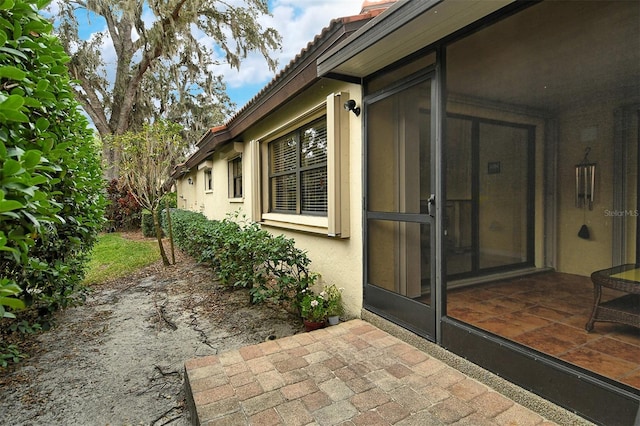 property entrance with a patio