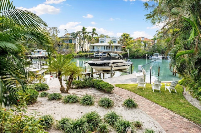 exterior space featuring a dock and a water view