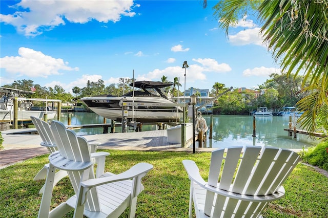 view of dock featuring a yard and a water view