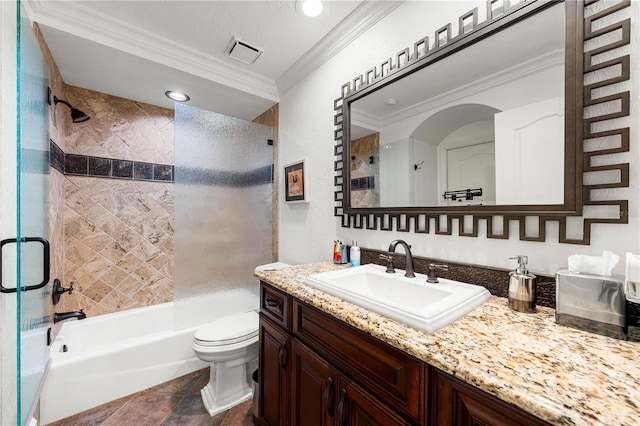 full bathroom with tiled shower / bath combo, tile patterned flooring, toilet, vanity, and ornamental molding