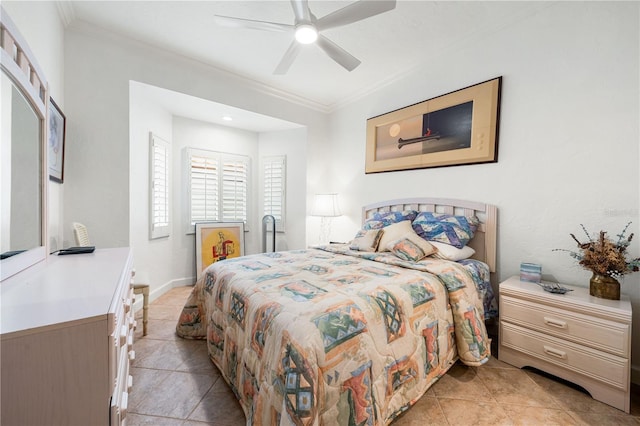 bedroom with ceiling fan, ornamental molding, and light tile patterned floors