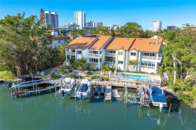 birds eye view of property with a water view