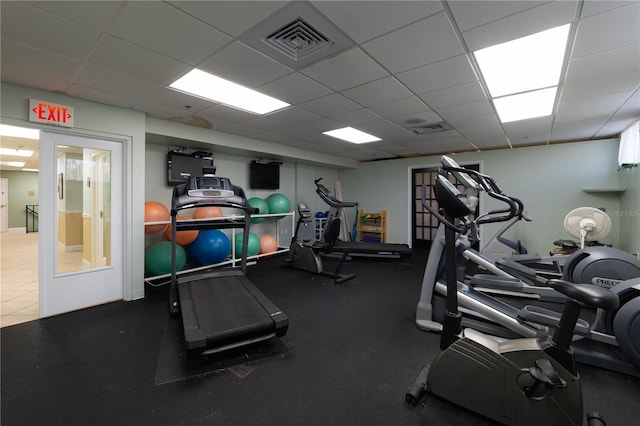 exercise room with a paneled ceiling