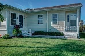 view of front of home with a front lawn