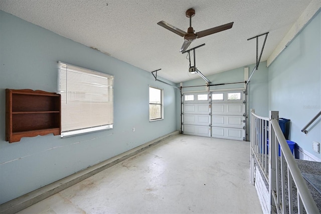 garage featuring ceiling fan and a garage door opener