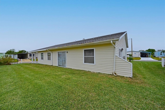 back of house featuring a yard