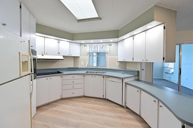 kitchen with white cabinets, white appliances, and sink