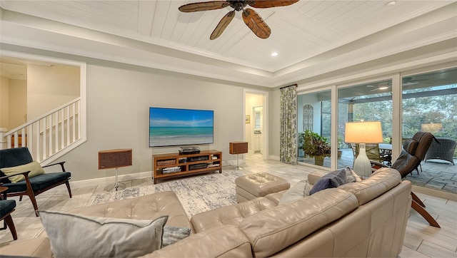 living room featuring ceiling fan, wooden ceiling, and a raised ceiling