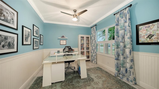 office area featuring a textured ceiling, ornamental molding, and ceiling fan