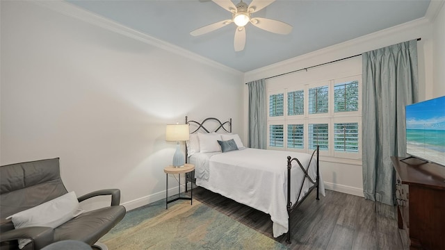 bedroom with ceiling fan, dark hardwood / wood-style flooring, and ornamental molding