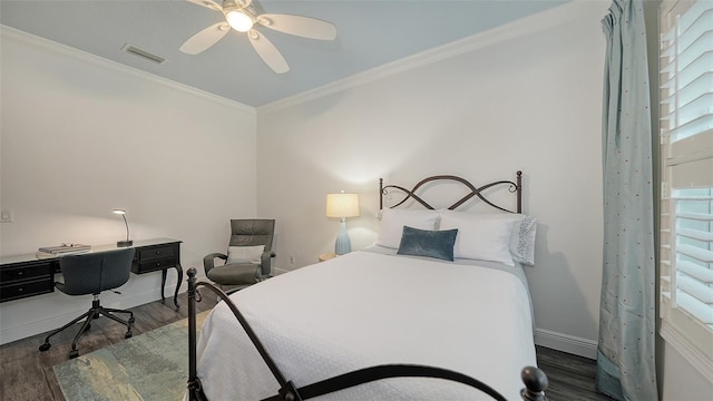 bedroom with multiple windows, ceiling fan, ornamental molding, and dark wood-type flooring