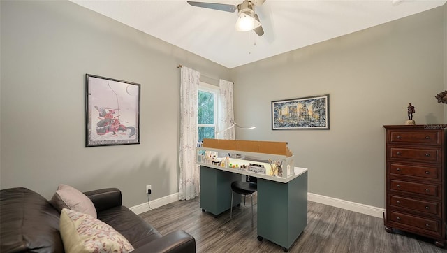 home office featuring dark wood-type flooring and ceiling fan