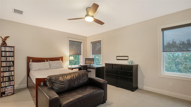 bedroom with light carpet and ceiling fan