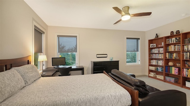 bedroom featuring ceiling fan and carpet