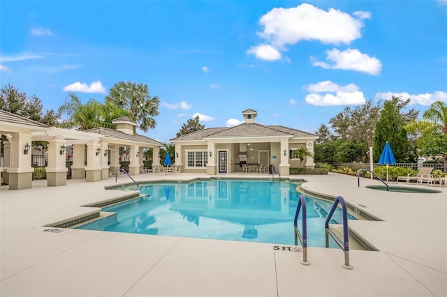 view of swimming pool featuring a gazebo, a patio area, and a hot tub