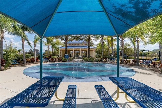 view of swimming pool featuring pool water feature