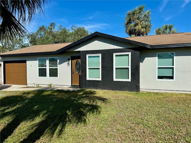 single story home featuring a garage and a front yard