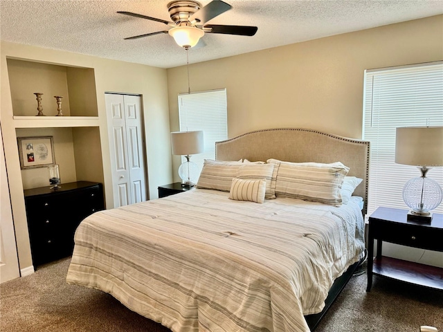 carpeted bedroom with multiple windows, ceiling fan, a closet, and a textured ceiling