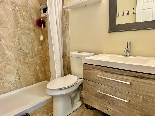 bathroom with tile patterned floors, vanity, toilet, and walk in shower