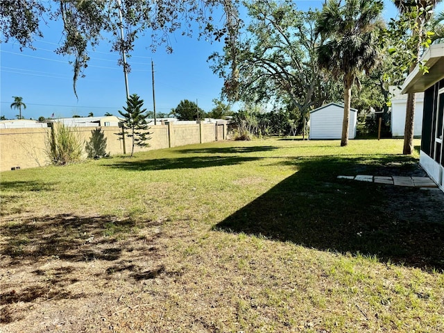 view of yard with a storage shed