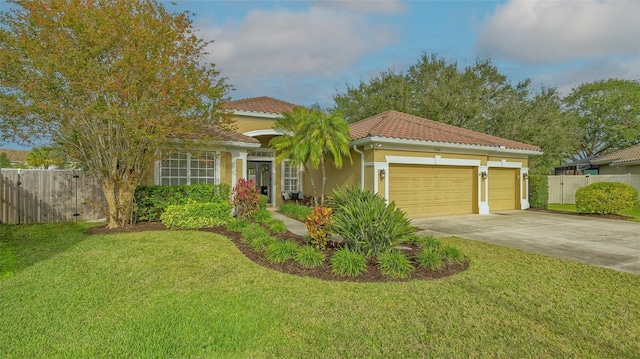 view of front of home featuring a garage and a front yard