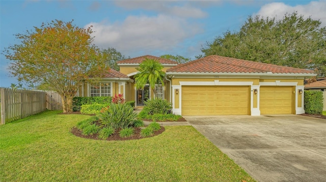 mediterranean / spanish house featuring a front lawn and a garage