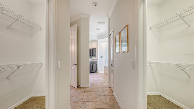 walk in closet featuring visible vents and light tile patterned flooring