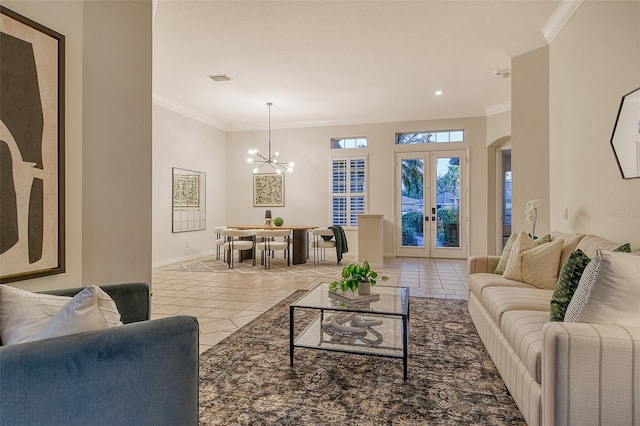 living room with baseboards, arched walkways, ornamental molding, and tile patterned floors