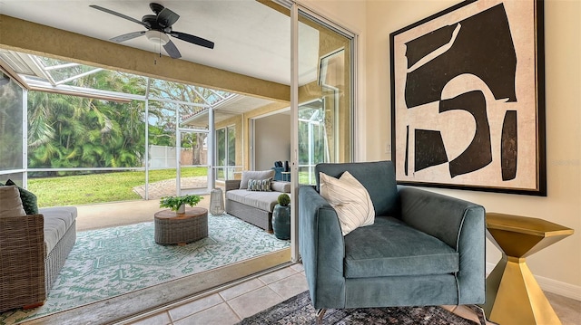 sunroom featuring ceiling fan