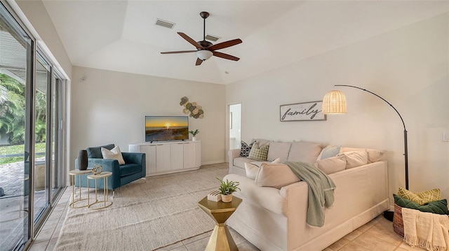 living area featuring light tile patterned floors, ceiling fan, and visible vents