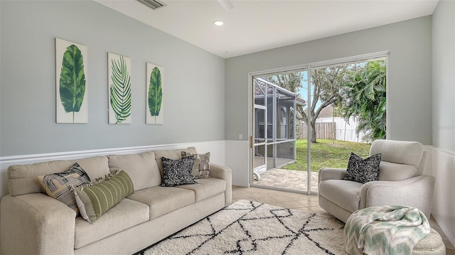 living area featuring recessed lighting, visible vents, and tile patterned floors