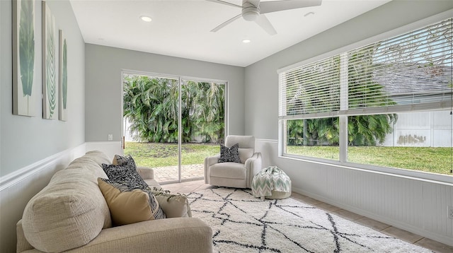 living room with a ceiling fan, tile patterned flooring, and recessed lighting