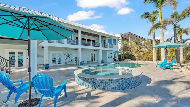 view of pool featuring french doors, ceiling fan, an in ground hot tub, and a patio