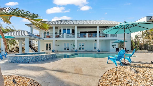 rear view of property with a patio area, a balcony, ceiling fan, and french doors