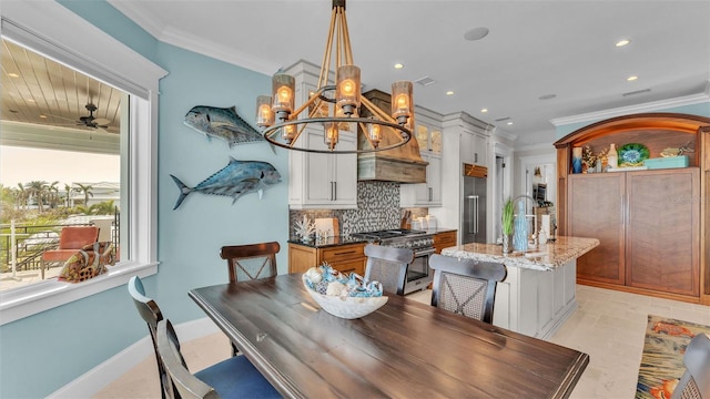 dining area with ceiling fan with notable chandelier and crown molding