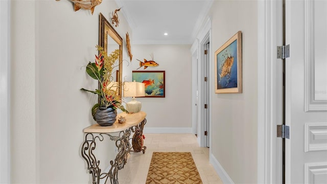 hallway featuring crown molding and light tile patterned floors