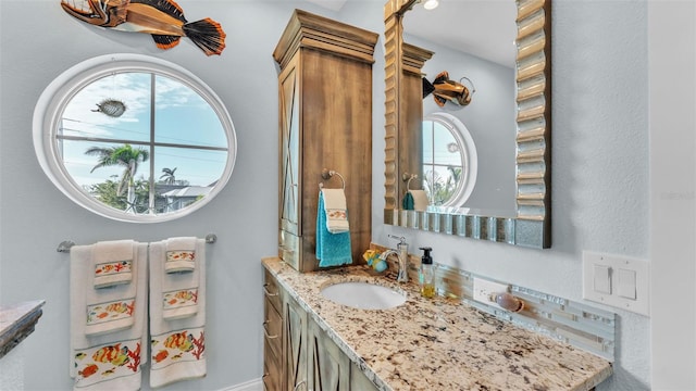 bathroom with a wealth of natural light and vanity