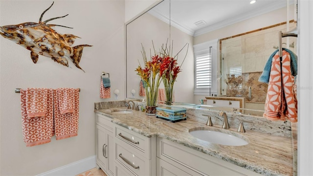 bathroom featuring ornamental molding and vanity