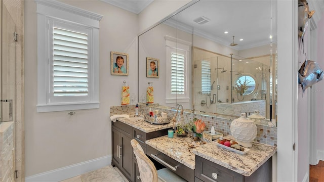 bathroom with ornamental molding, walk in shower, backsplash, and vanity