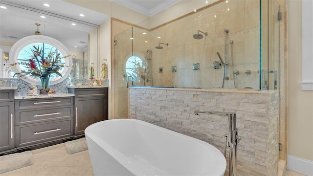 bathroom featuring vanity, a wealth of natural light, and independent shower and bath