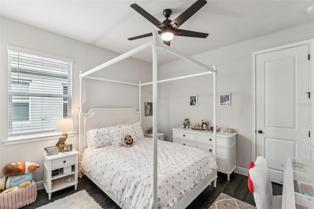 bedroom featuring ceiling fan and dark wood-type flooring