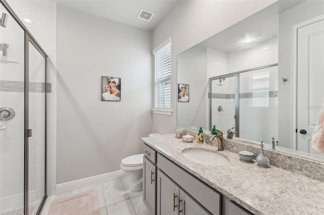 bathroom featuring vanity, toilet, and walk in shower