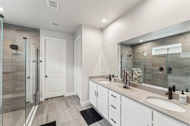 bathroom with vanity and walk in shower