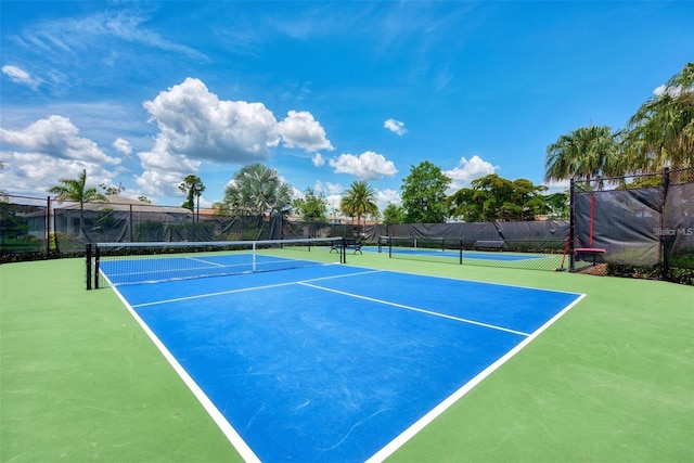 view of sport court with basketball hoop