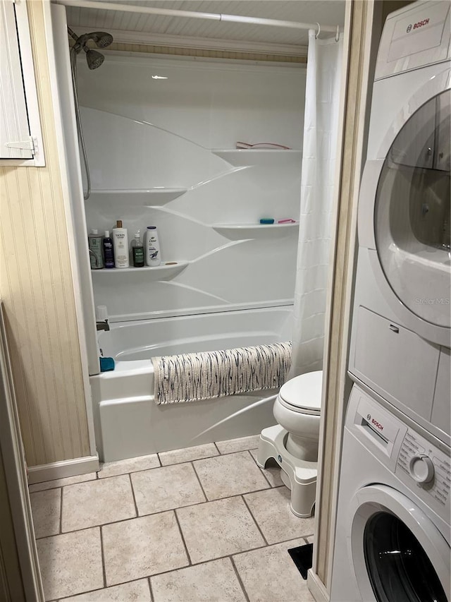 laundry area featuring stacked washing maching and dryer