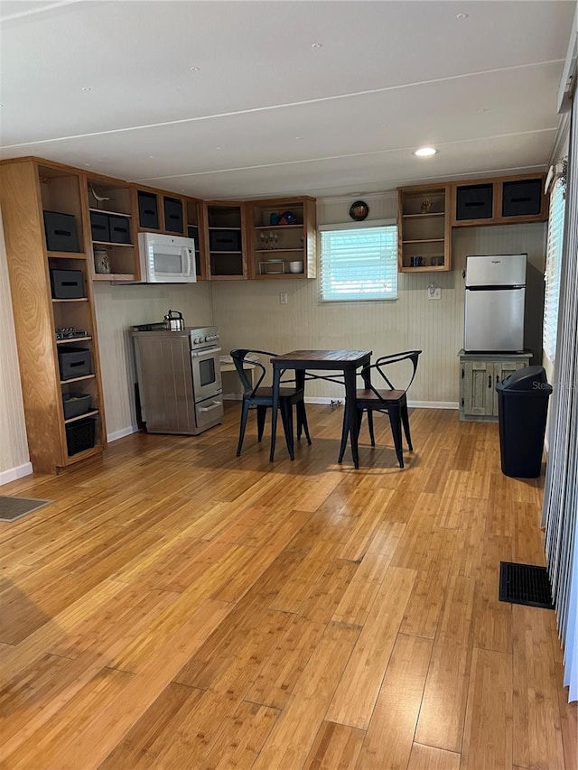 dining room with light hardwood / wood-style flooring